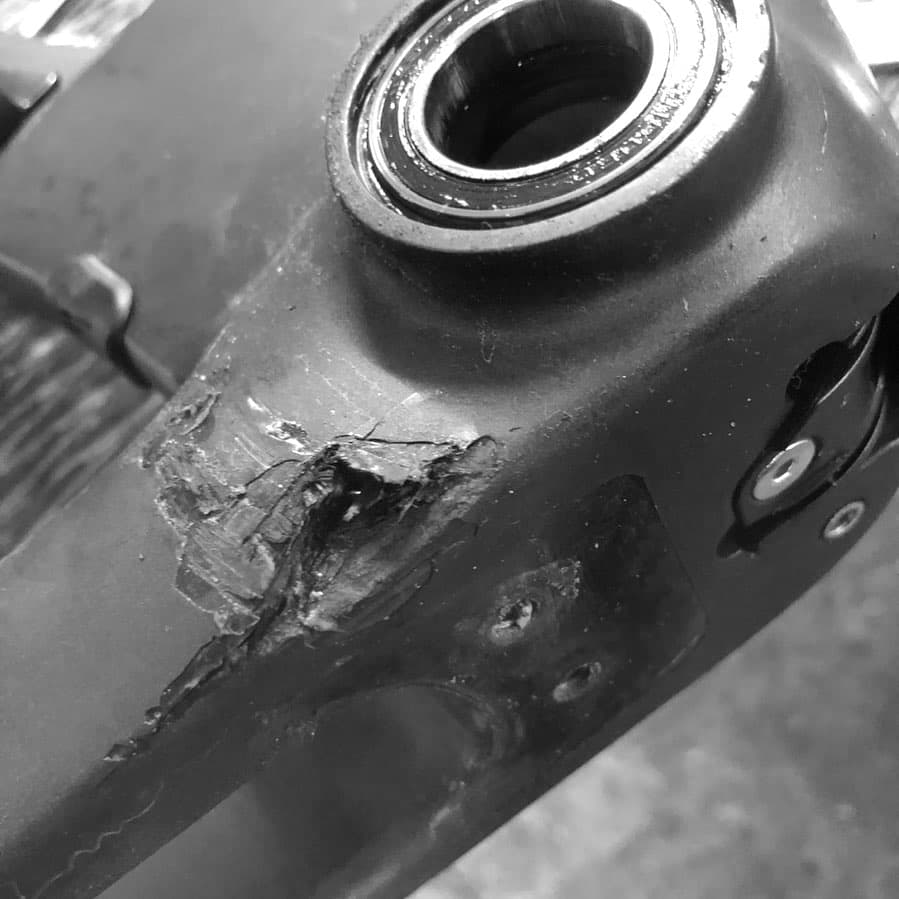 A Picture of a Broken Carbon Fibre Road bike with Chain damage